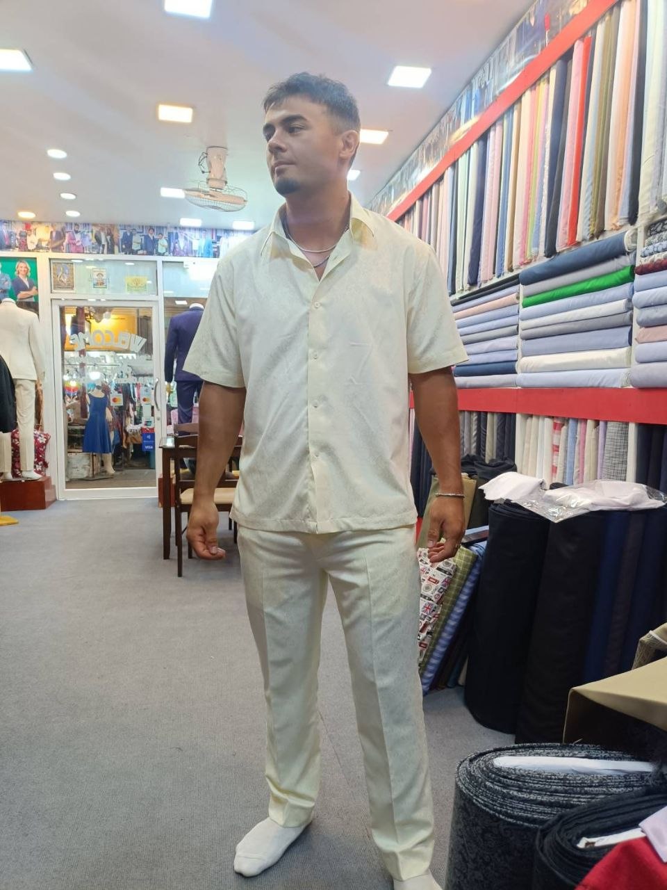 Customer wearing a light short-sleeve tailored shirt