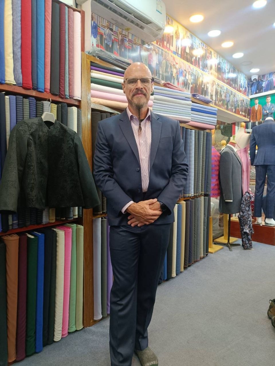 Customer wearing a navy business suit at Smart Fashion